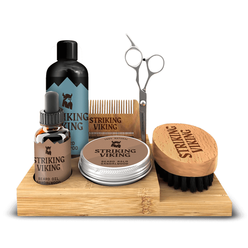 Beard grooming kit with caddy, including beard oil, shampoo, balm, scissors, brush, and comb.