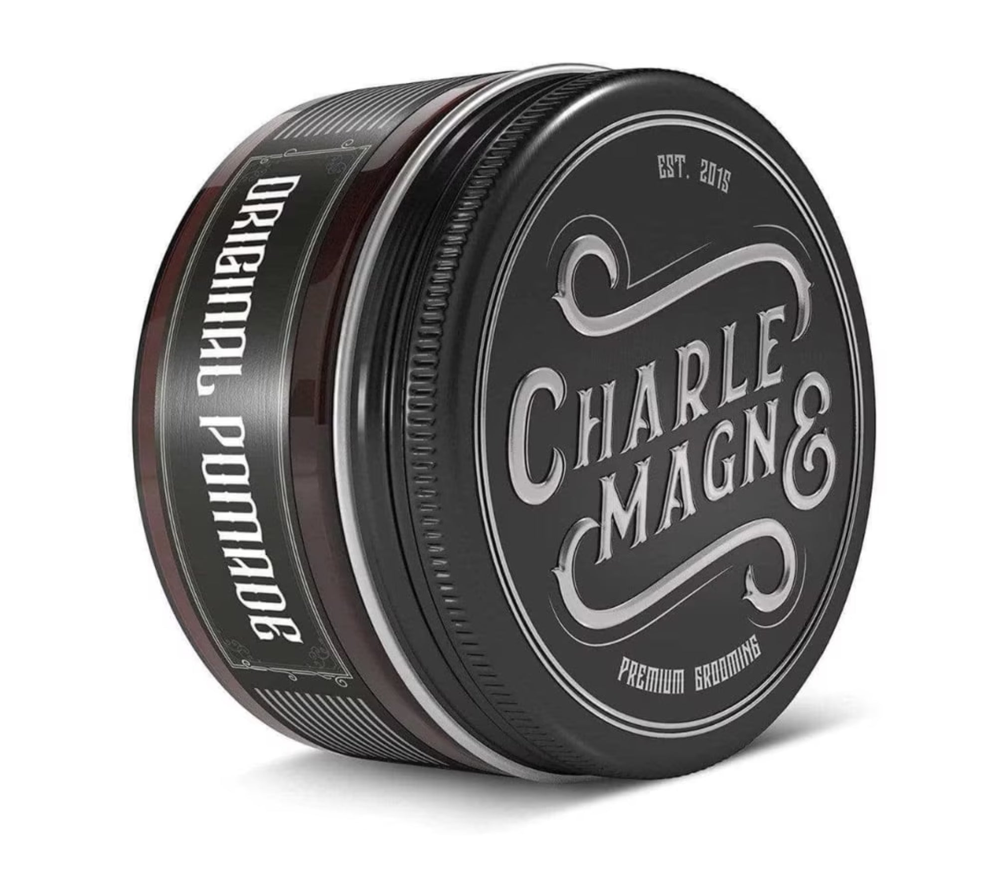 A black metal tin of Charle Magn& Original Pomade, showing the front label and side label, on a white background.
